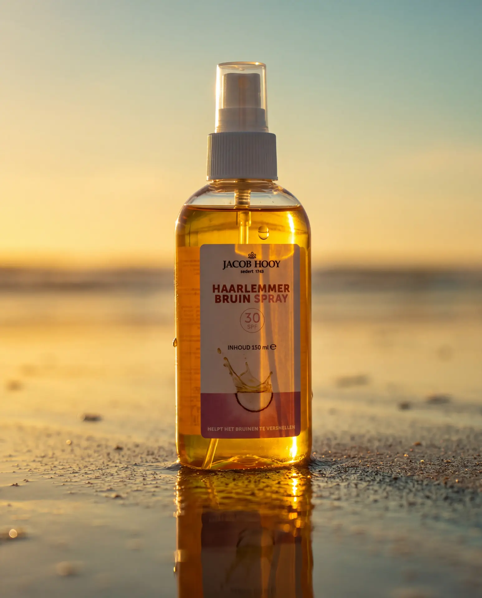 Woman holding the Jacob Hooy tanning spray beside her face in warm evening light